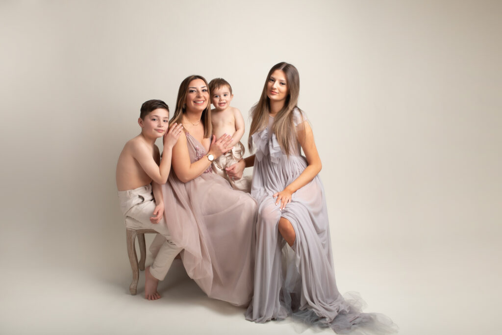 parent with children all in neutral coloured outfits by family photoshoot in Hull
